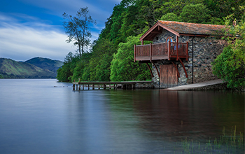 stone and wooden cottage on jungle riverside